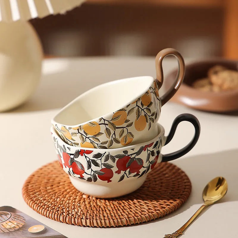 Antique style ceramic coffee cup and saucer with 210ml capacity in black pomegranate or orange citrus pattern.