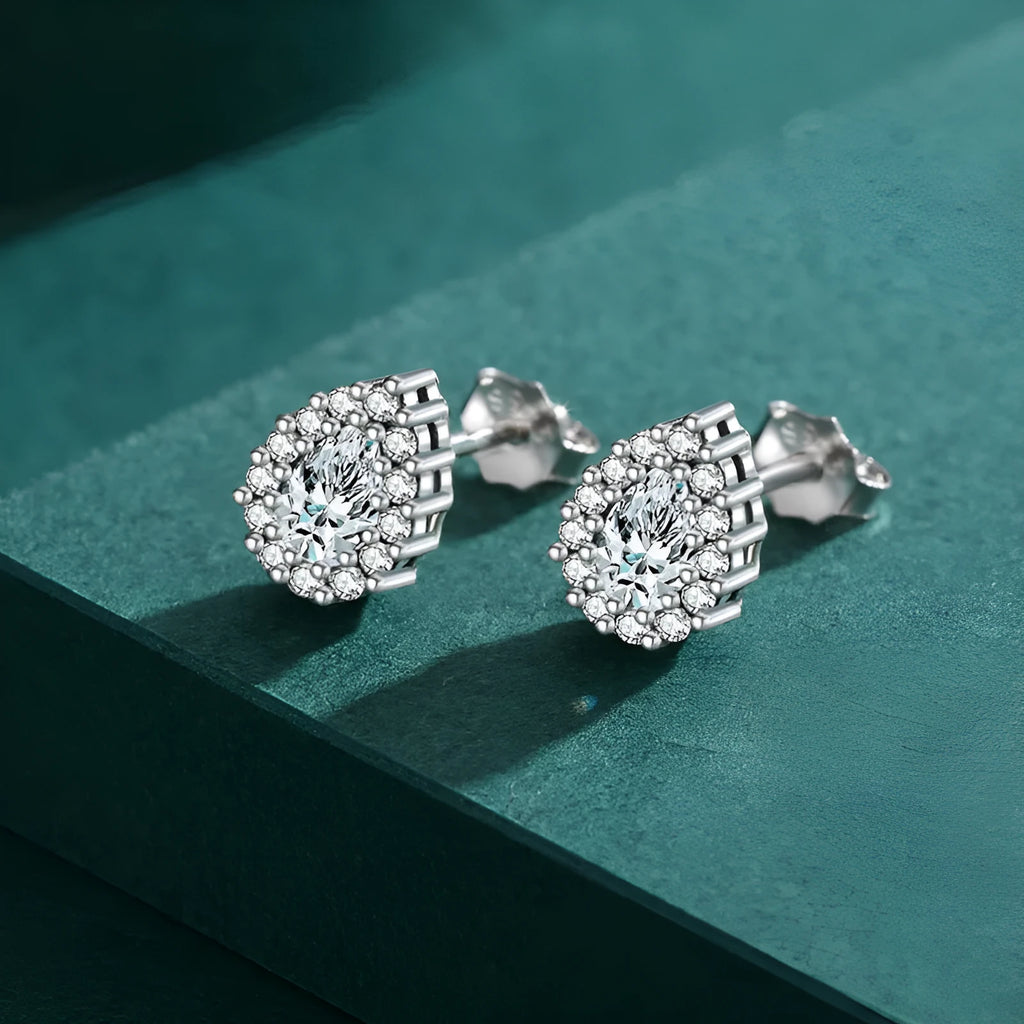 A pair of women's silver water drop shaped stud earrings made from 925 sterling silver.