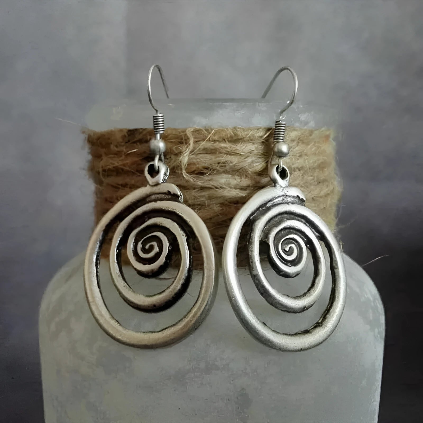 Geometric spiral earrings in distressed silver with national style design elements