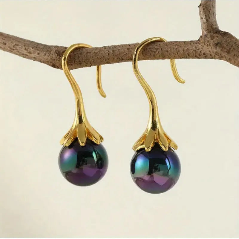 A pair of retro-style women's earrings with an electroplated imitation gold finish