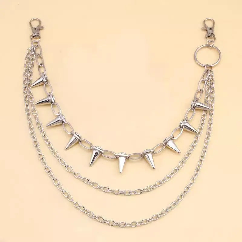 Silver metal double layer pants chain with rivet ornaments on dark trousers