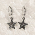 Women's classic alloy earrings showing cross, heart, and animal designs in white, black, and silver colours