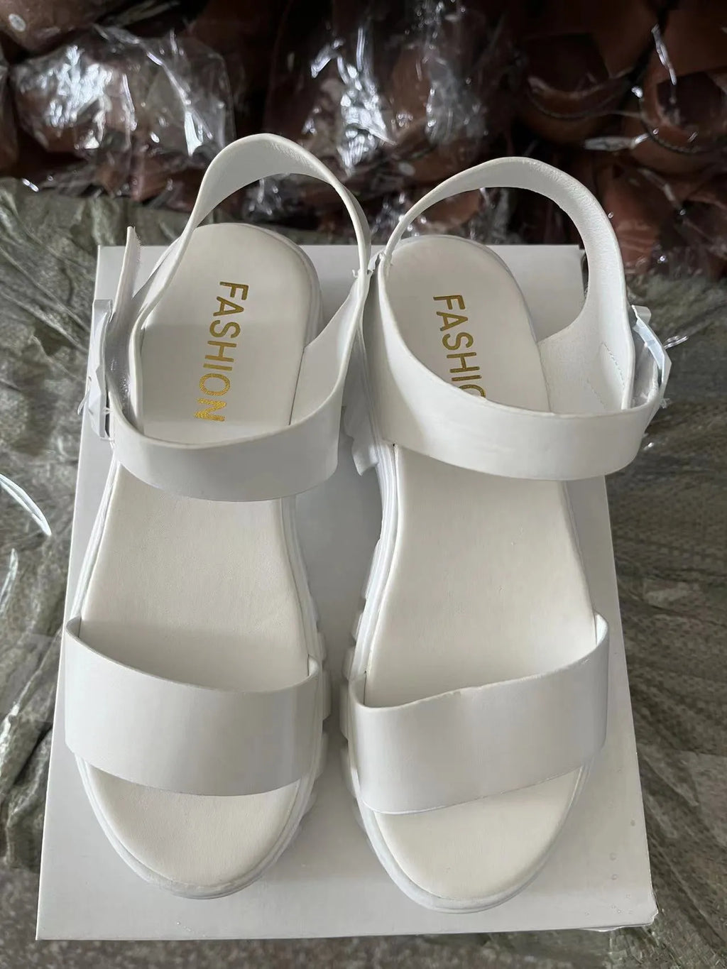 Beige women's platform sandals with ankle-strap buckle and peep toe fish mouth design.
