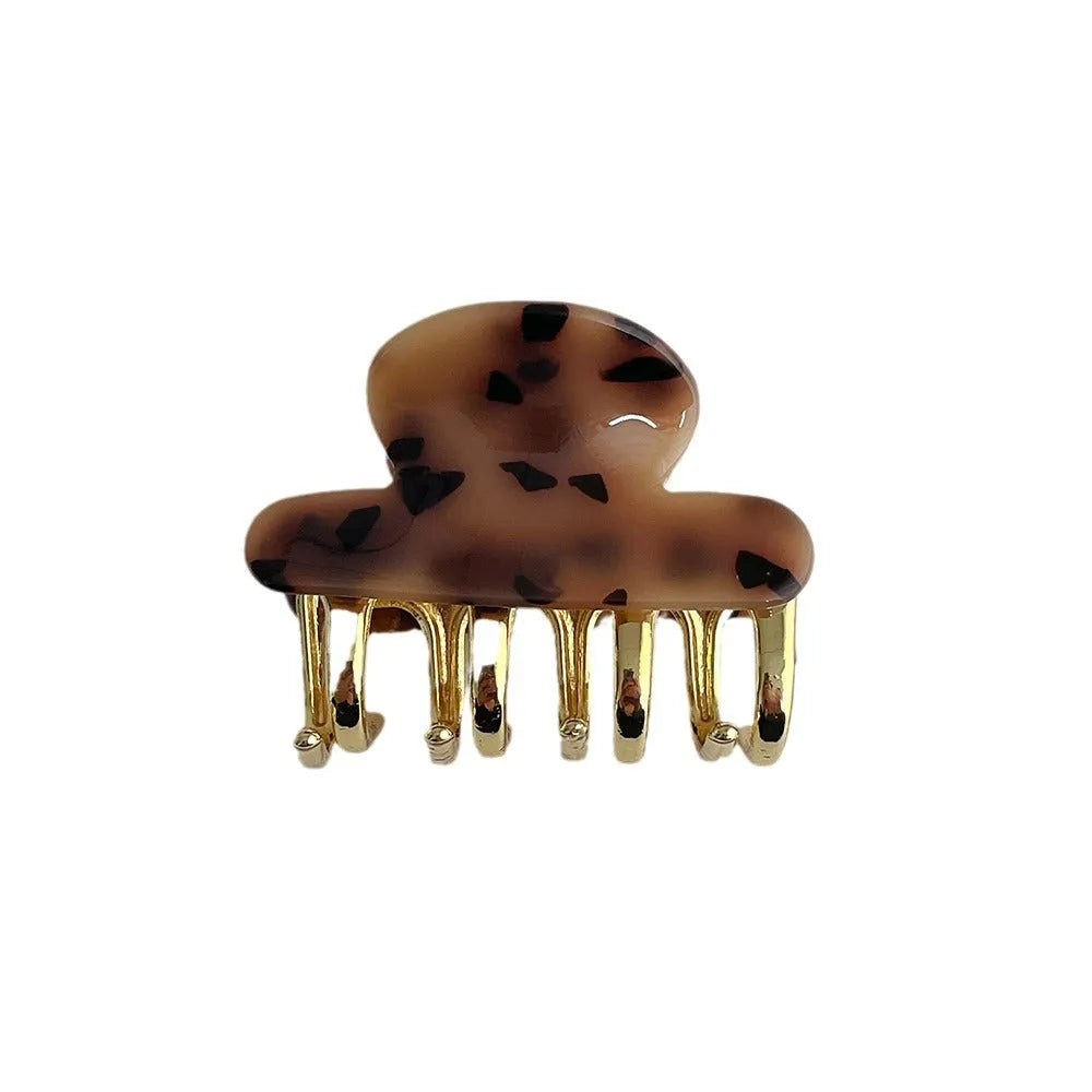 Acetate hair barrettes with metal grip closure in leopard print, beige, white and ink colours