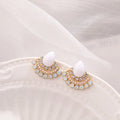 Women's silver-colour retro fan-shaped stud earrings with rhinestone detail on a white background.