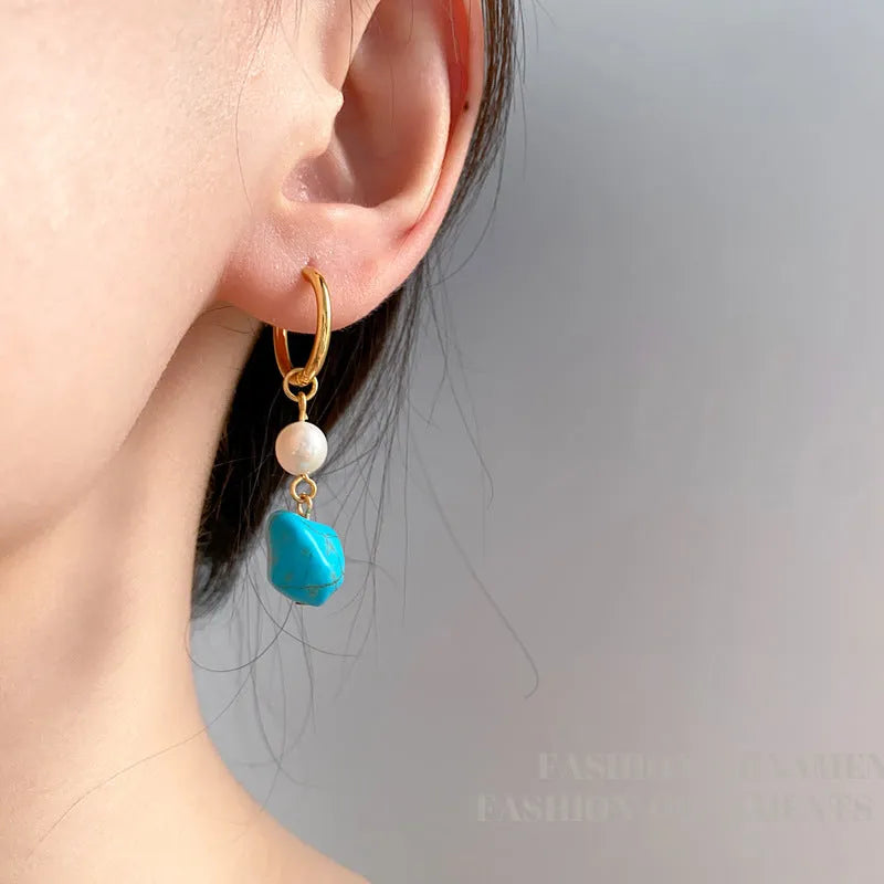 A pair of long and a pair of short geometric clip-on earrings with turquoise and cultured pearls.