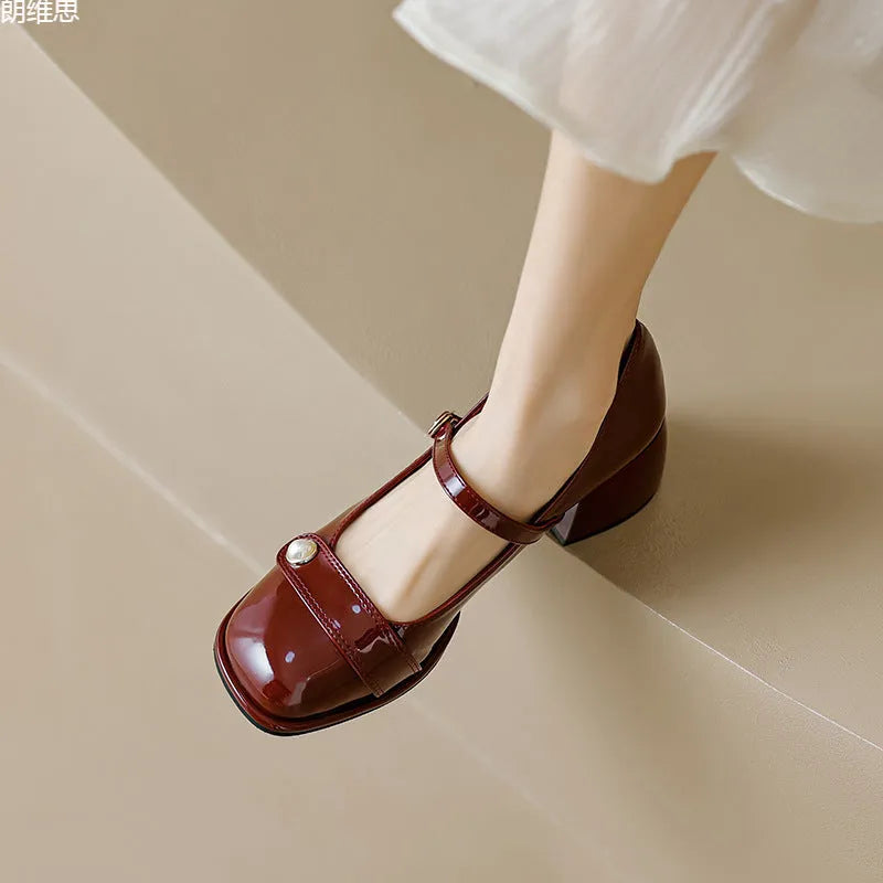 Women's patent leather chunky heel pump in apricot with square toe and buckle closure