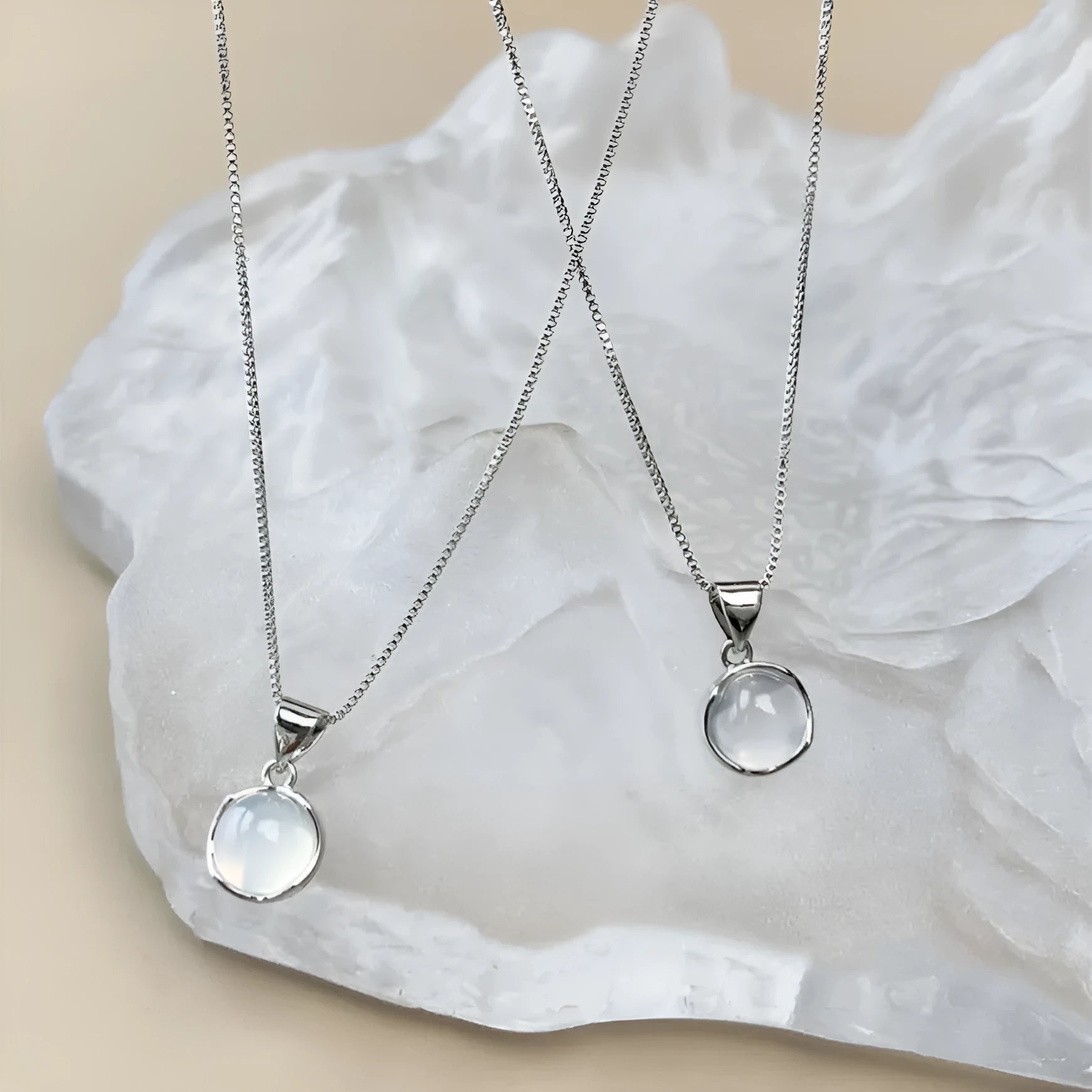 Korean-style oval pendant necklace with an eight-point star on an adjustable silver-toned box chain.