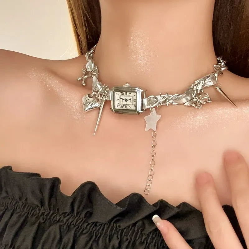 Dark multi-layer cross necklace with twin clavicle chain and textured hemp flowers chain on model