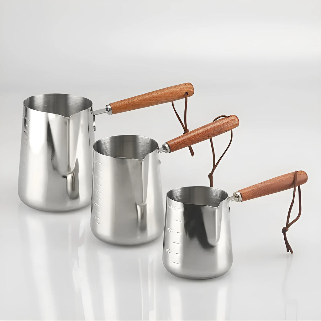 Stainless steel coffee cup with wooden handle and interior measuring scale