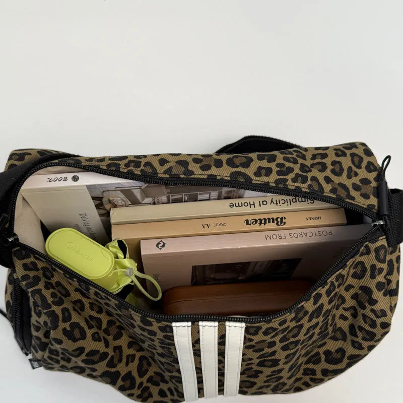 Leopard print sports style shoulder messenger bag with striped lining and stitching details