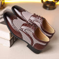 Man's imitation houndstooth plaid casual shoe in black with square toe and lace-up front.