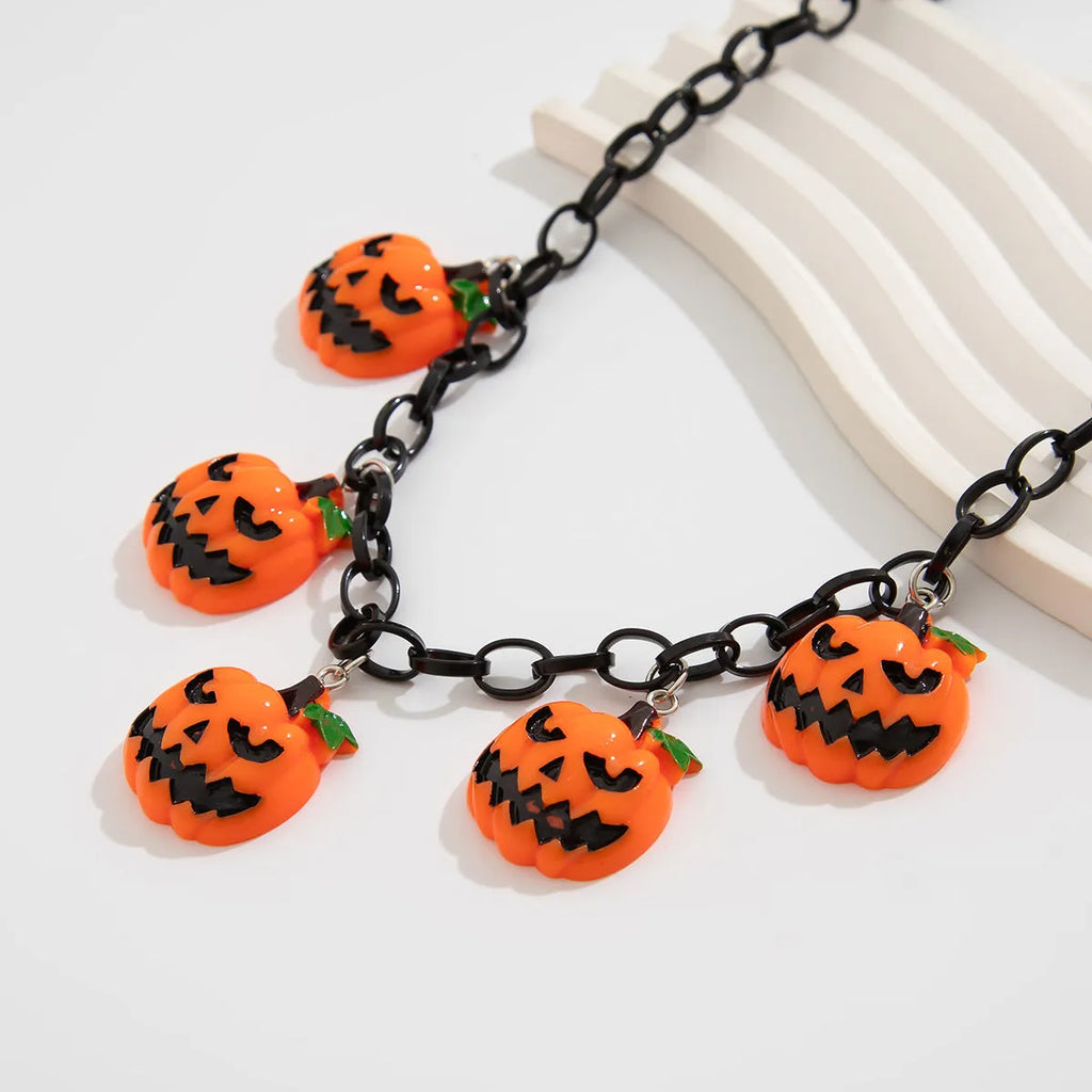 Mixed colour ghost pumpkin acrylic necklace on a regular chain, cartoon Halloween styling.
