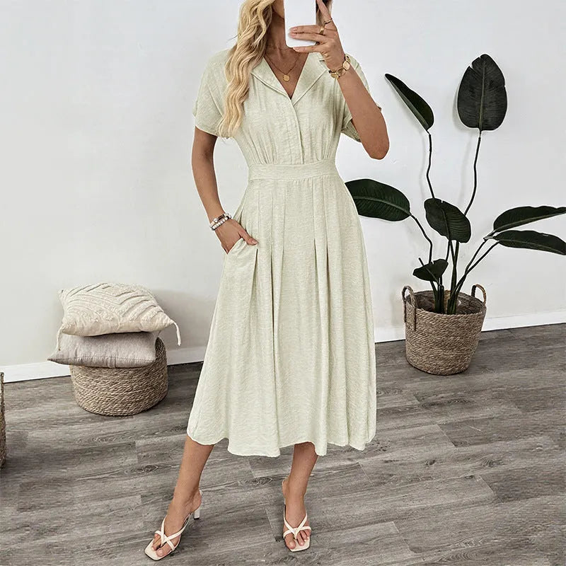 Light green women's twill shirt dress with lapel collar, adjustable waist belt, and splicing detail