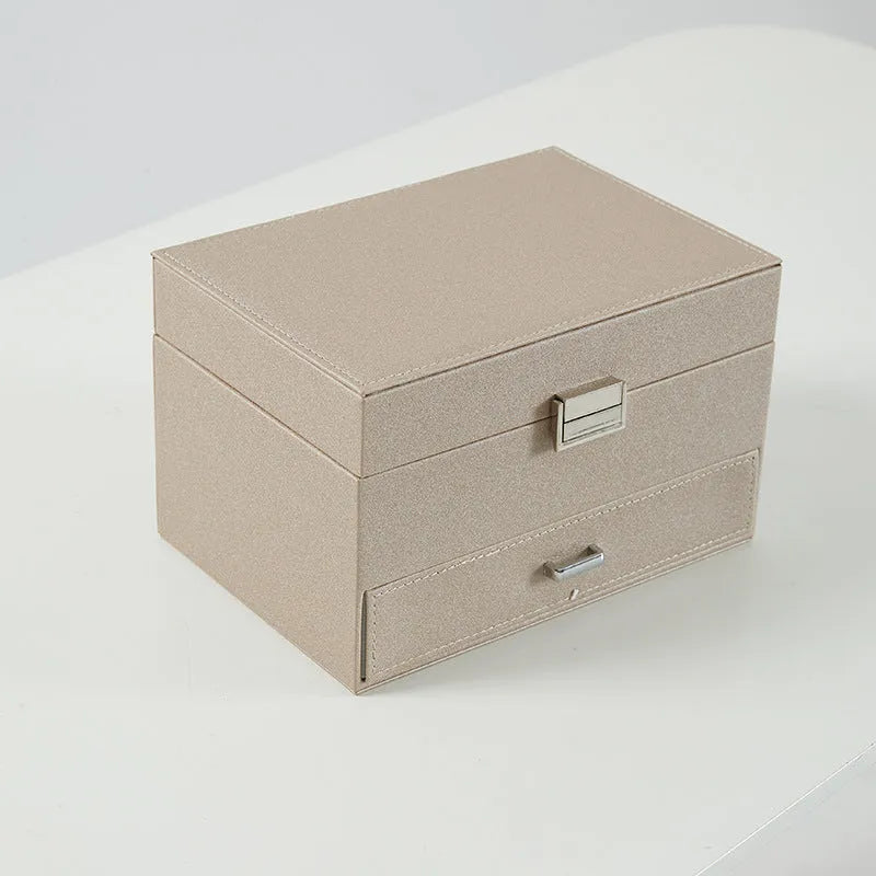 Hard leather jewellery storage box in beige, black, pink, or rose gold colour.