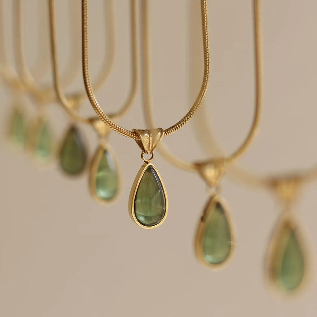 Retro water drop necklace with mixed gem inlaid pendant on a titanium steel snake chain in blue and green colour options.