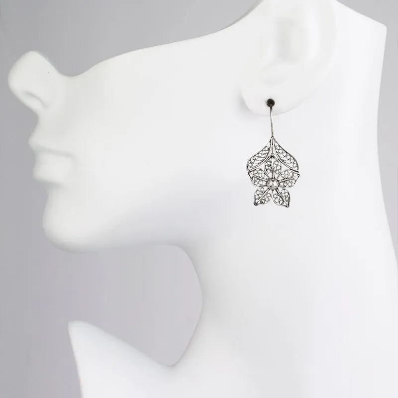 Silver-colour alloy women's earrings with a hollow retro flower leaf shape.