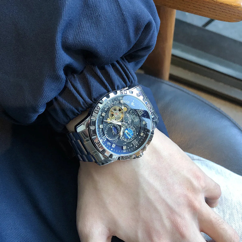 Men's silver case automatic mechanical watch with black starry dial, luminous hands, and leather strap