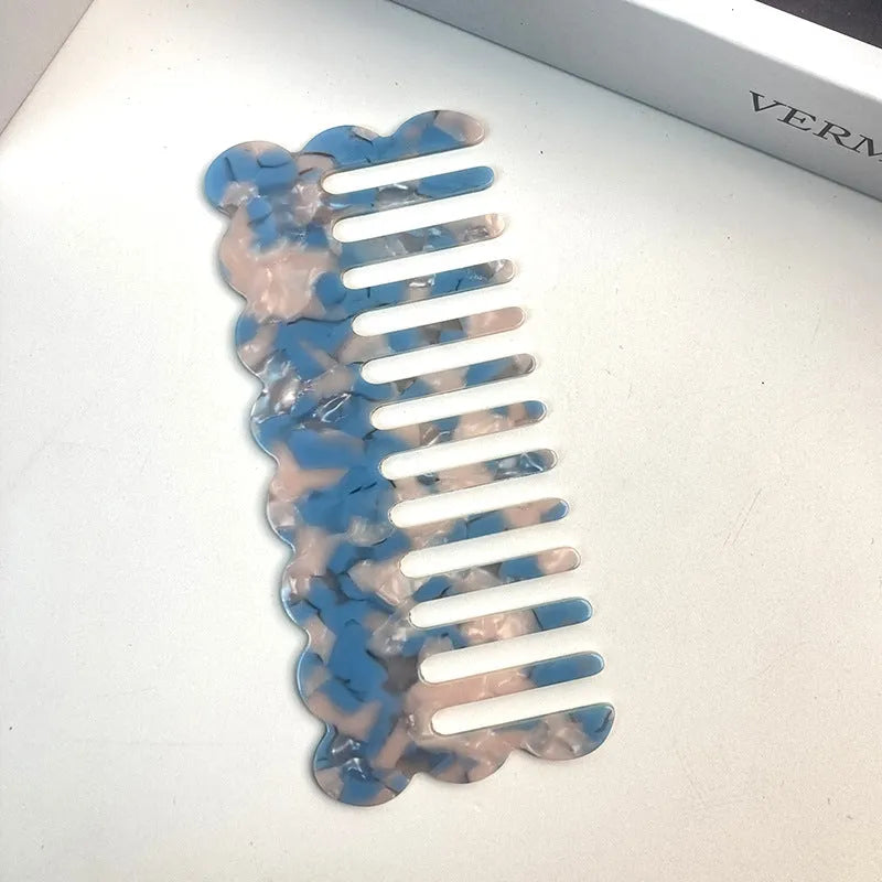 Acetate board geometric wave hairdressing comb for women in pink colour, showing wave shape and lightweight construction