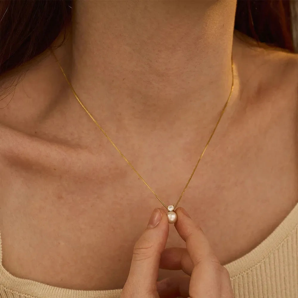 St Delan stainless steel necklace for women with imitation pearl and zircon pendant on a box chain.