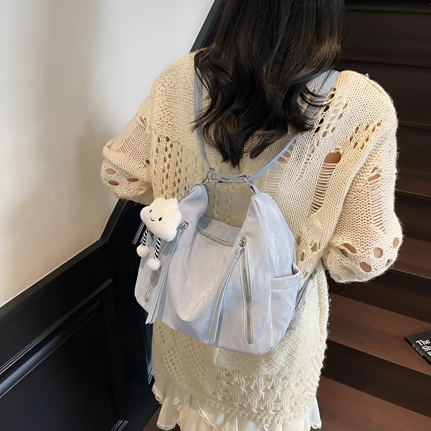 Women's soft PU fashion backpack in multiple colours showing backpack and shoulder bag carrying options with pendant accessory