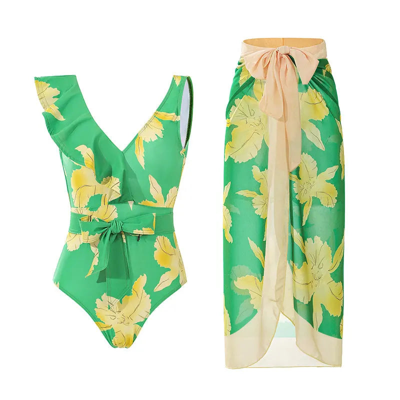 Solid colour women's one-piece swimsuit with thin spaghetti straps and a matching detachable skirt.
