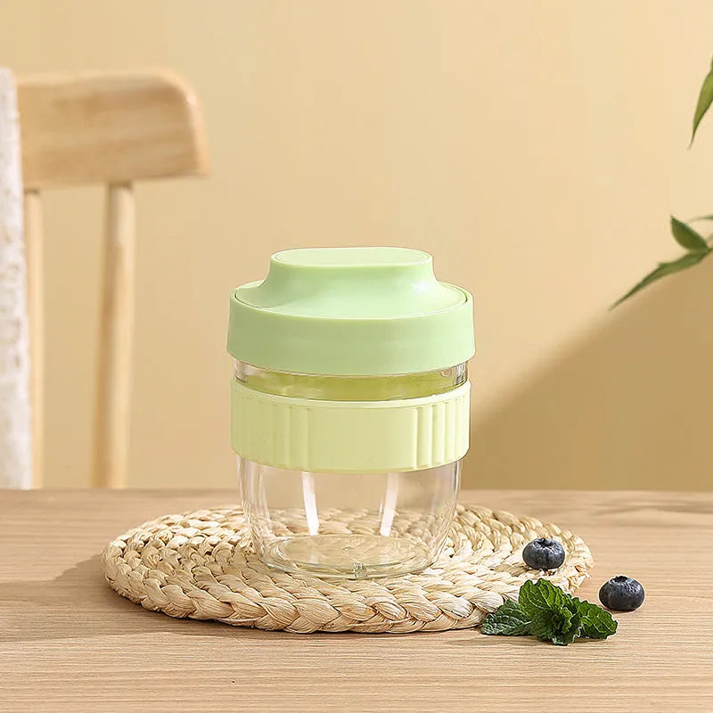 Green microwave-safe plastic salad cup with white resealable lid and integrated spoon, shown with capacity options.