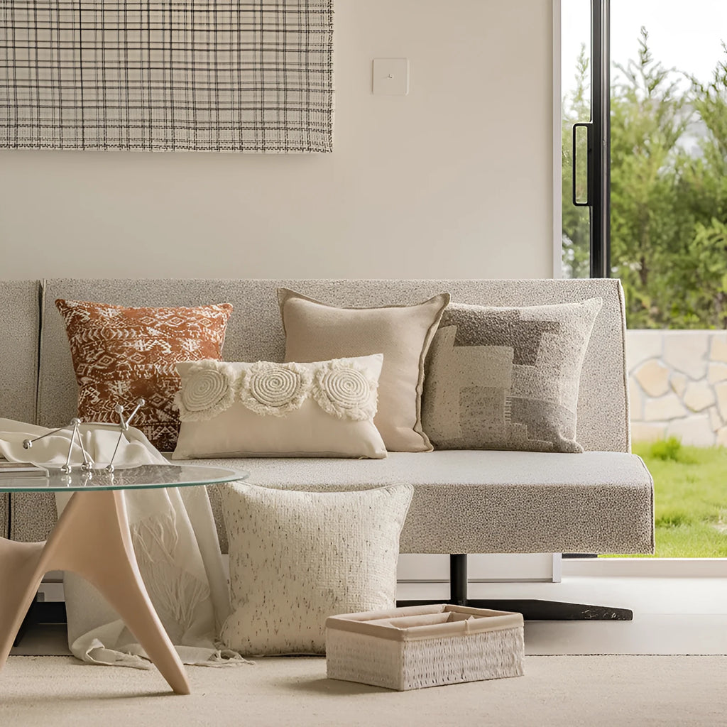 Solid colour rectangular and square sofa cushions with removable covers on a bay window seat