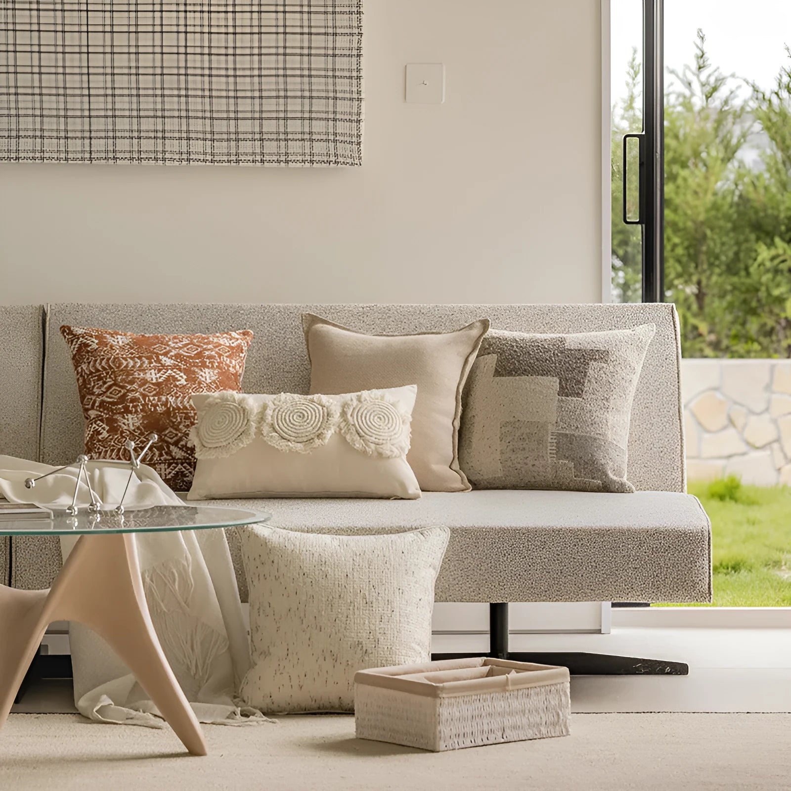 Solid colour rectangular and square sofa cushions with removable covers on a bay window seat