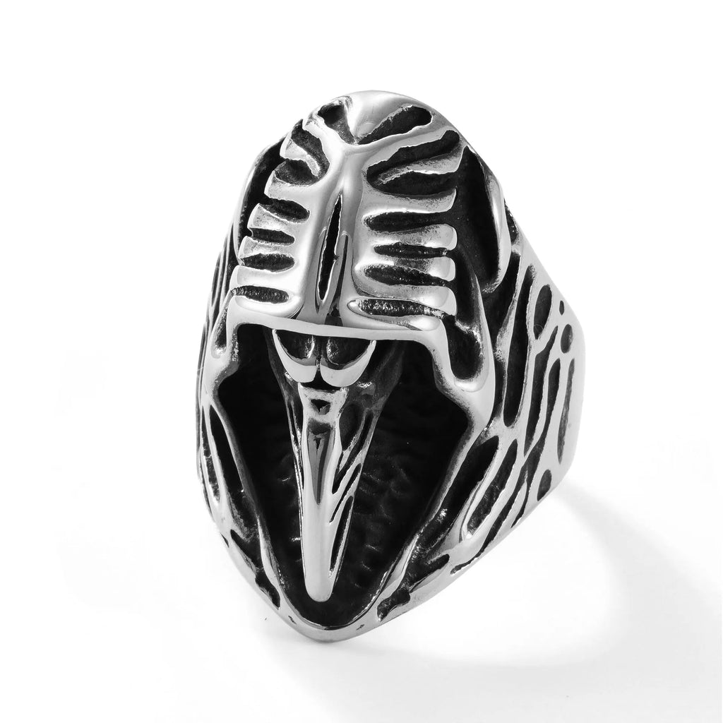 Geometric crow punk ring in titanium steel, MR166 colour, shown on a finger.