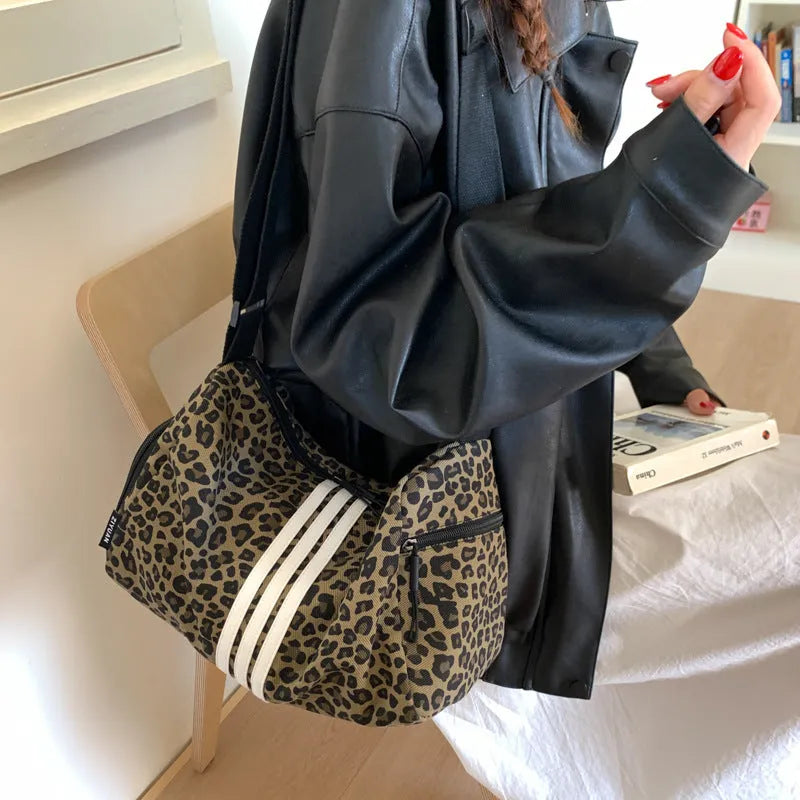 Leopard print sports style shoulder messenger bag with striped lining and stitching details