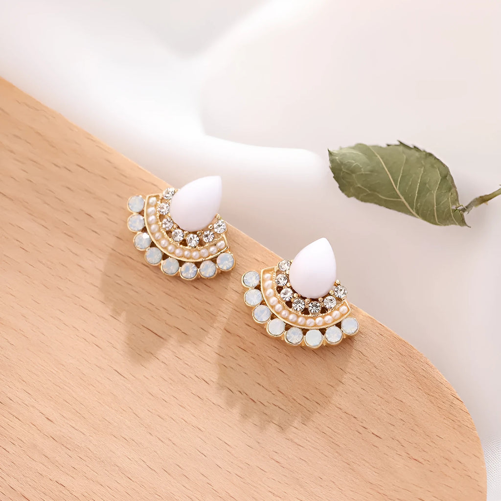 Women's silver-colour retro fan-shaped stud earrings with rhinestone detail on a white background.