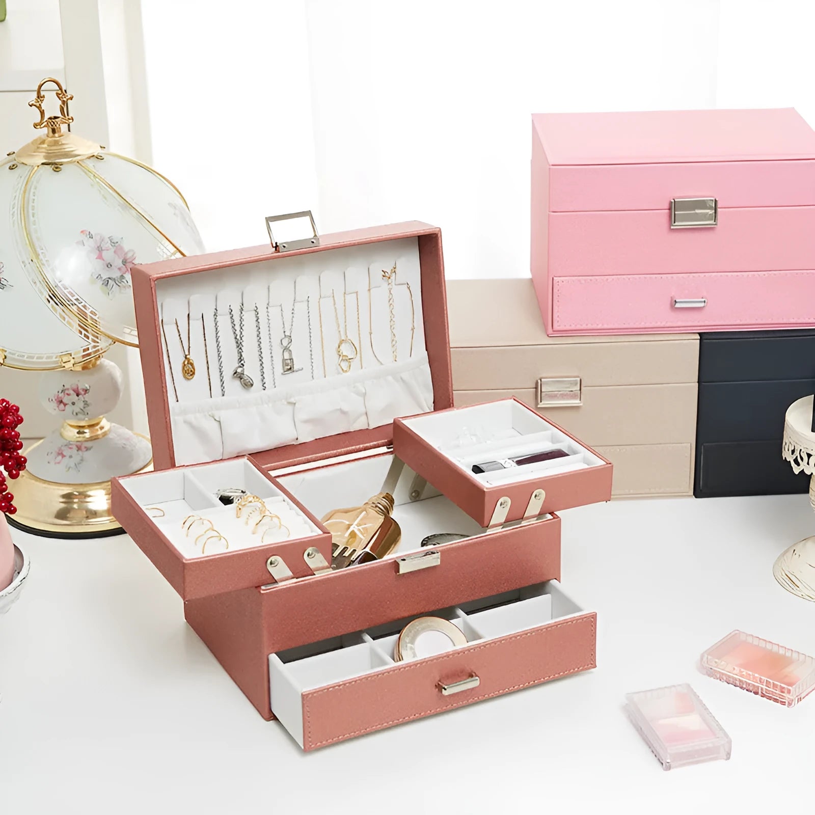 Hard leather jewellery storage box in beige, black, pink, or rose gold colour.