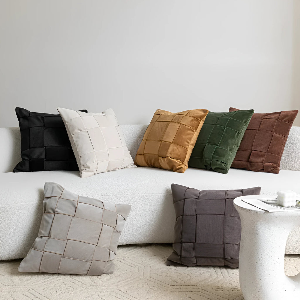 Square woven chenille pillow cushion in beige colour on a grey sofa, 50cm by 50cm size.