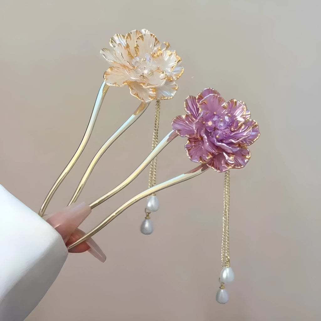 Close-up of a retro U-shaped alloy hairpin with a purple peony flower and tassel design.