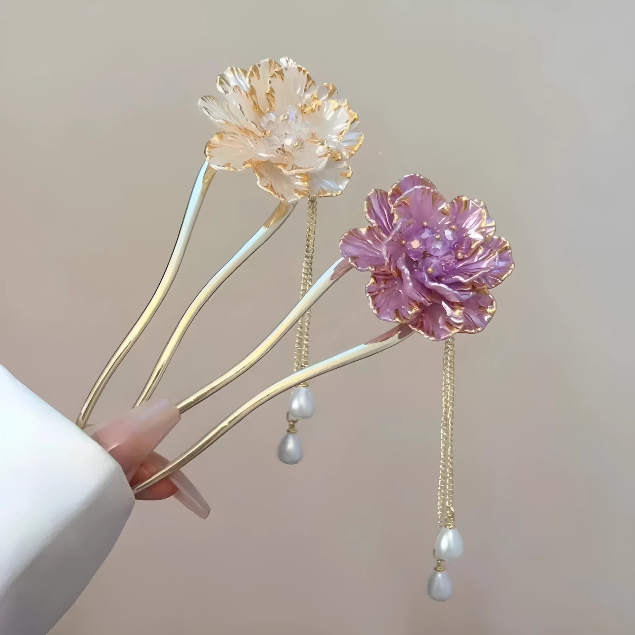 Close-up of a retro U-shaped alloy hairpin with a purple peony flower and tassel design.