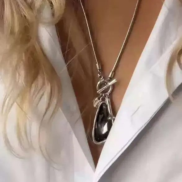 Long geometric plaid alloy pendant on a snake bones chain necklace in blue, champagne, or grey.