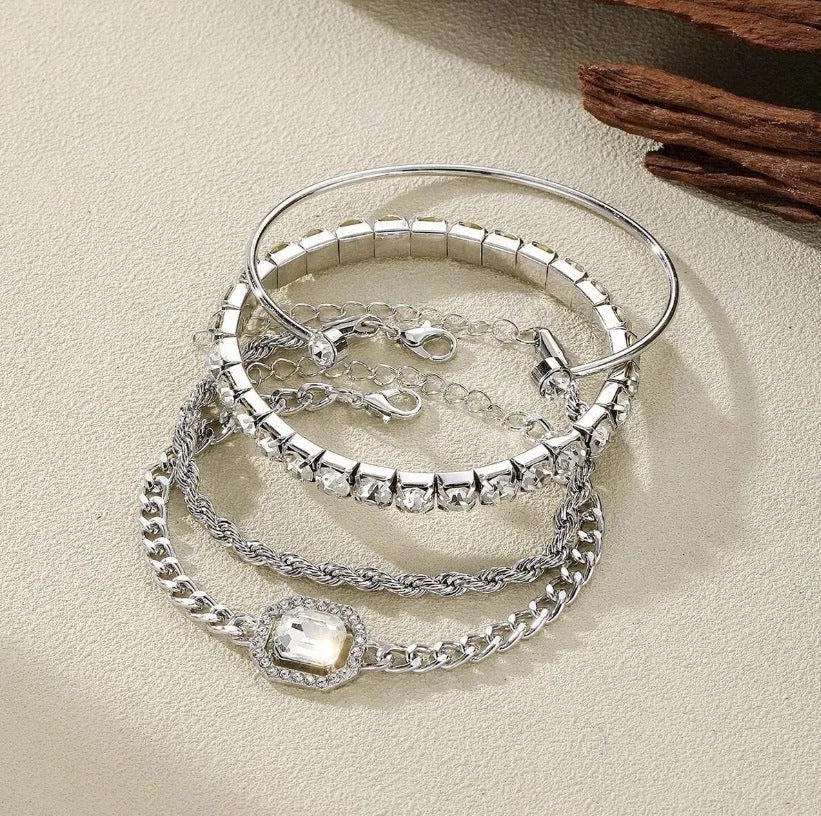Four geometric retro-style alloy bracelets with square diamond design in gold and silver colours