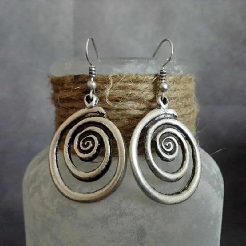 Geometric spiral earrings in distressed silver with national style design elements