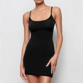 Black slim fit sleeveless sling sheath dress on a model, showing short skirt and mid-waist.