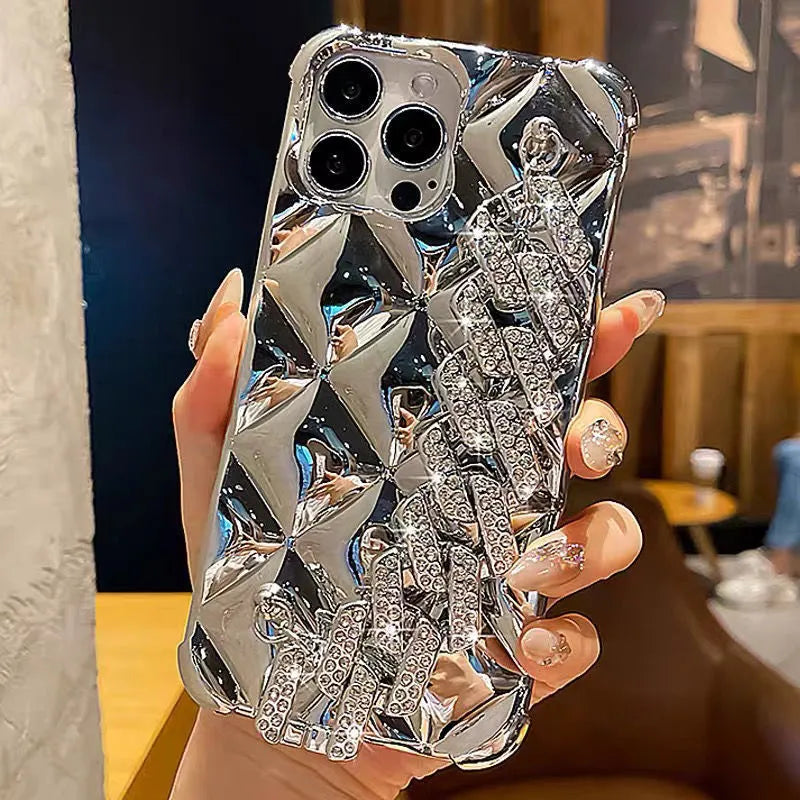 Luxury diamond bracelet design iPhone case in gold and silver colours with chain detail.