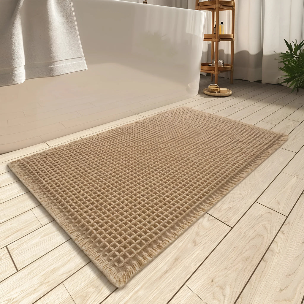 A square, checkered-pattern absorbent bathroom floor mat with a non-slip backing, shown in a neutral colour.