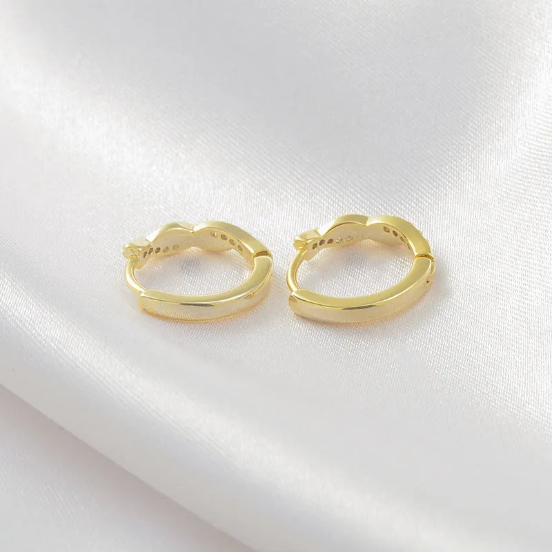 Geometric interwoven hemp rope earclip earrings for women in gold and silver colour options.