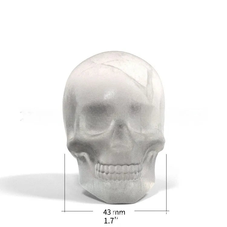 Silicone Halloween ice tray making 3D skull-shaped ice cubes.