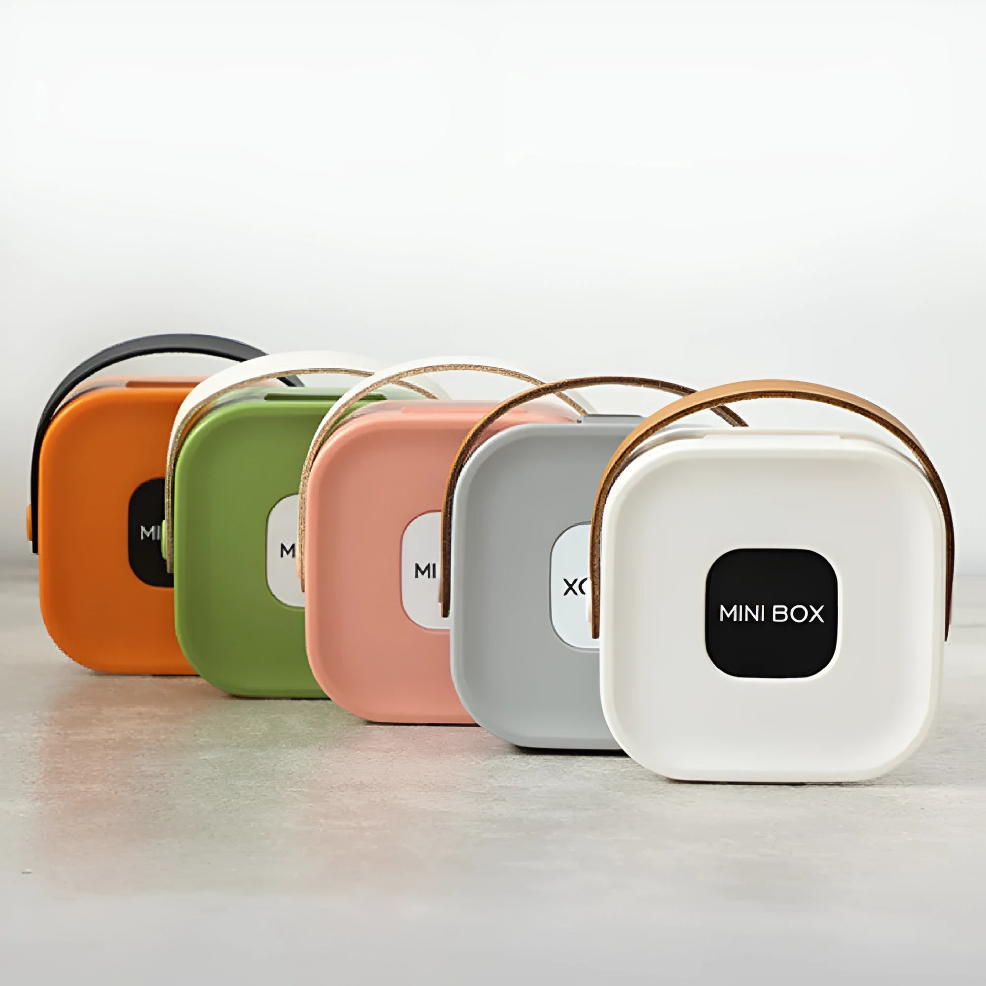 Medium solid colour polypropylene storage box for organising cables, shown in Nordic White.