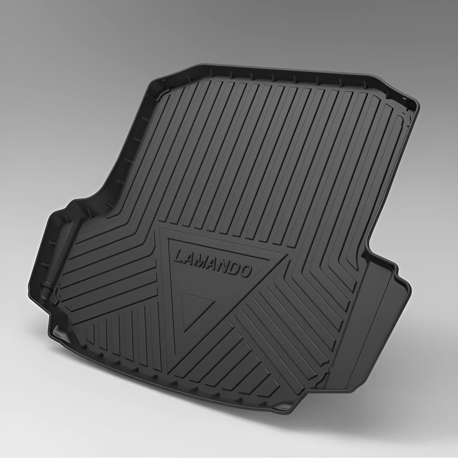 Black carbon fibre pattern TPE rubber boot liner mat for a car trunk.