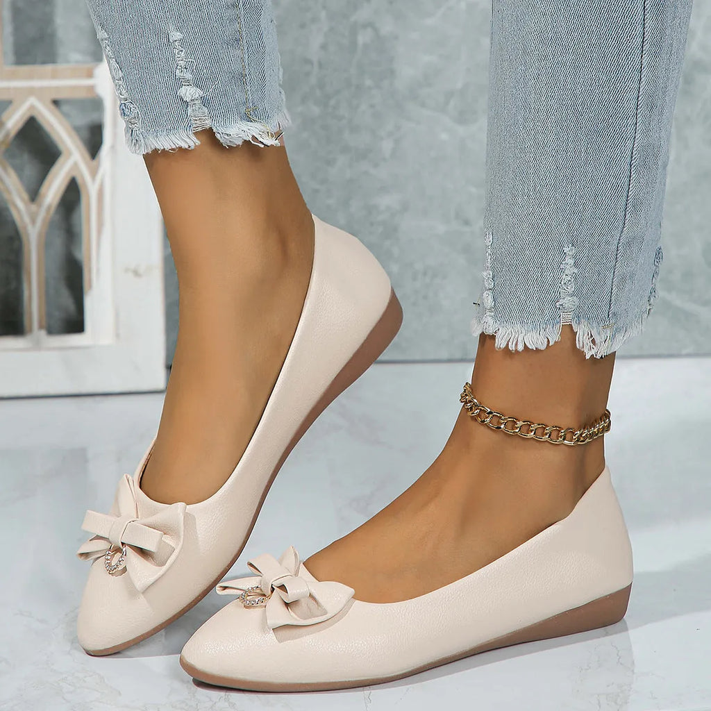 Women's beige casual flat shoes with a bowknot and round toe, showing the shallow mouth design.