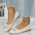 Women's beige casual flat shoes with a bowknot and round toe, showing the shallow mouth design.