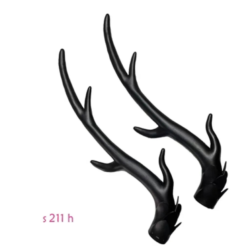 A pair of detailed black resin dragon horn decorations for customising motorcycle and scooter helmets.