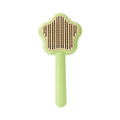 Green self-cleaning cat comb with stainless steel needles and retraction button